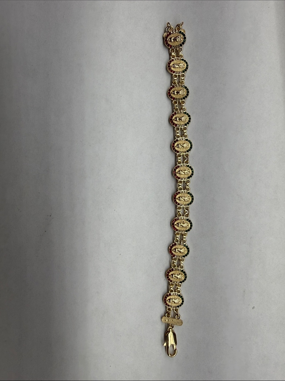 Gold-Tone Oval Medallion Bracelet with Red and Black Accents